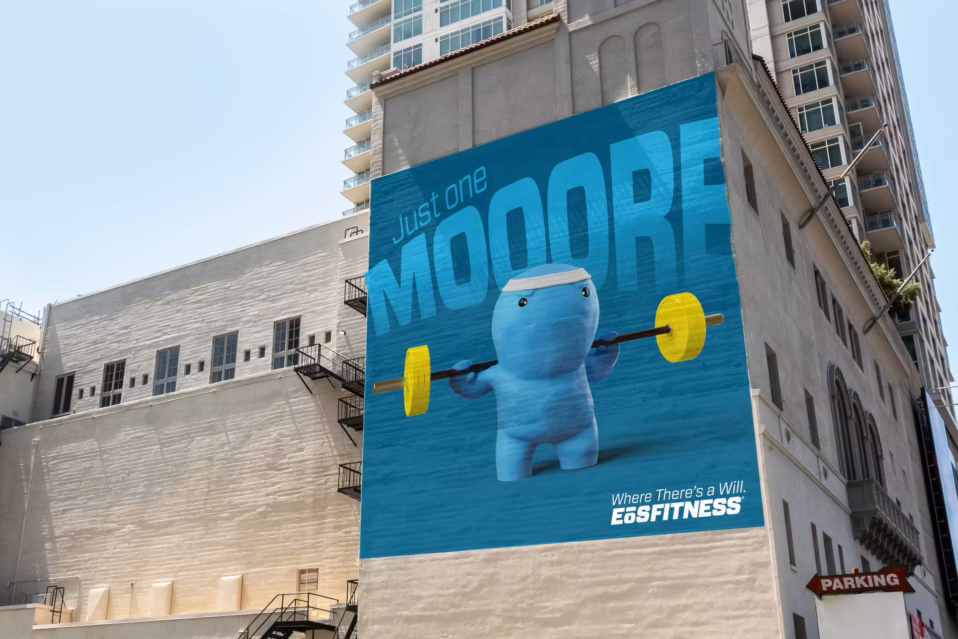 Ad with Will Power lifting weights on a blue background with the ad being displayed on the side of a large high-rise building in an urban setting.